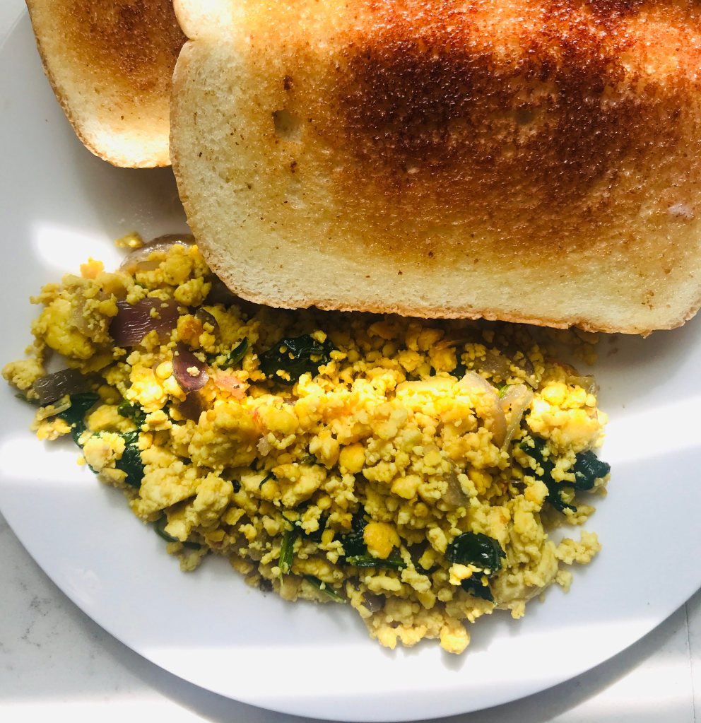 Scrambled tofu with buttered bread toast