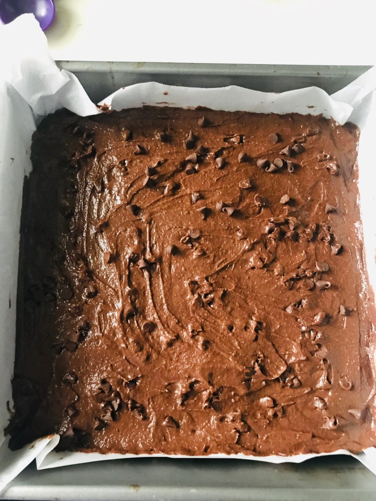 Vegan avocado brownie batter in baking pan
