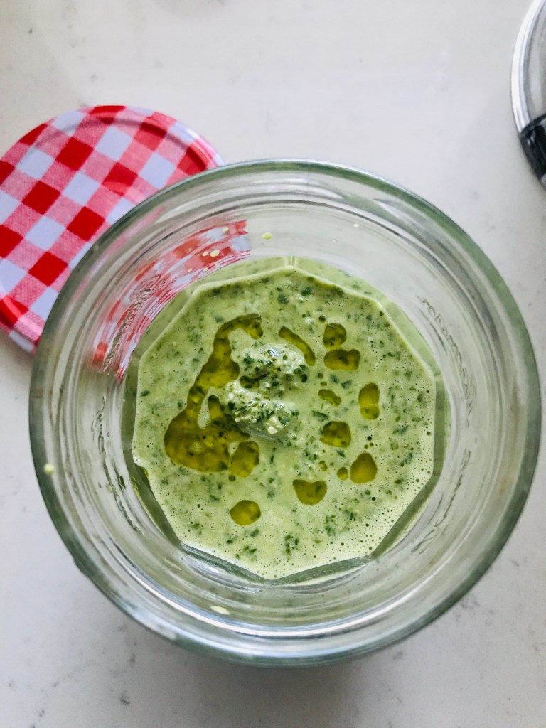vegan pesto sauce stored in a jar
